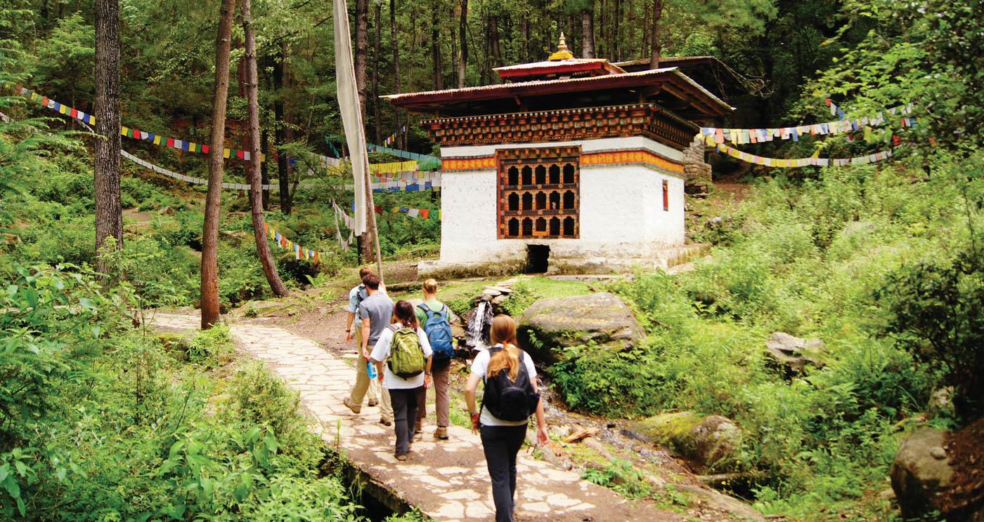 students walking on trail in asia