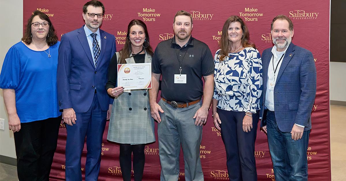 Shore Hatchery Fall 2025 photo from event shows a judge talking to contestants 