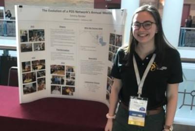 Emma Reider in front on her poster presentation