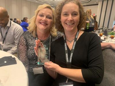 Clara Outten poses with award