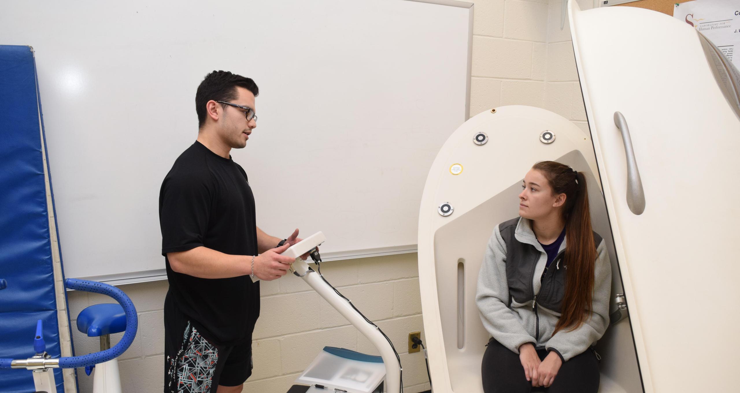 students using bod pod in lab