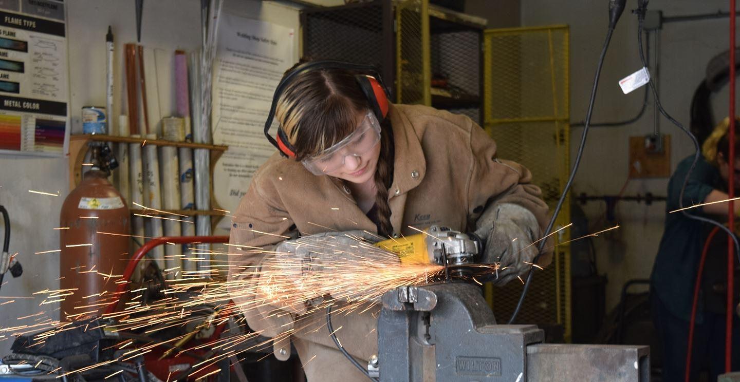 student working in metal shop