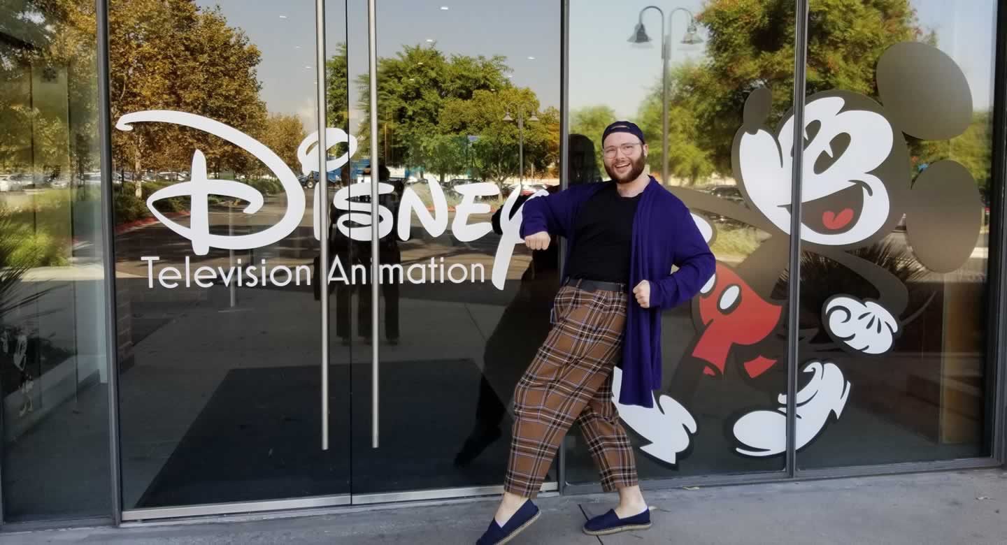 Andy Garner-Flexner in front of Disney sign