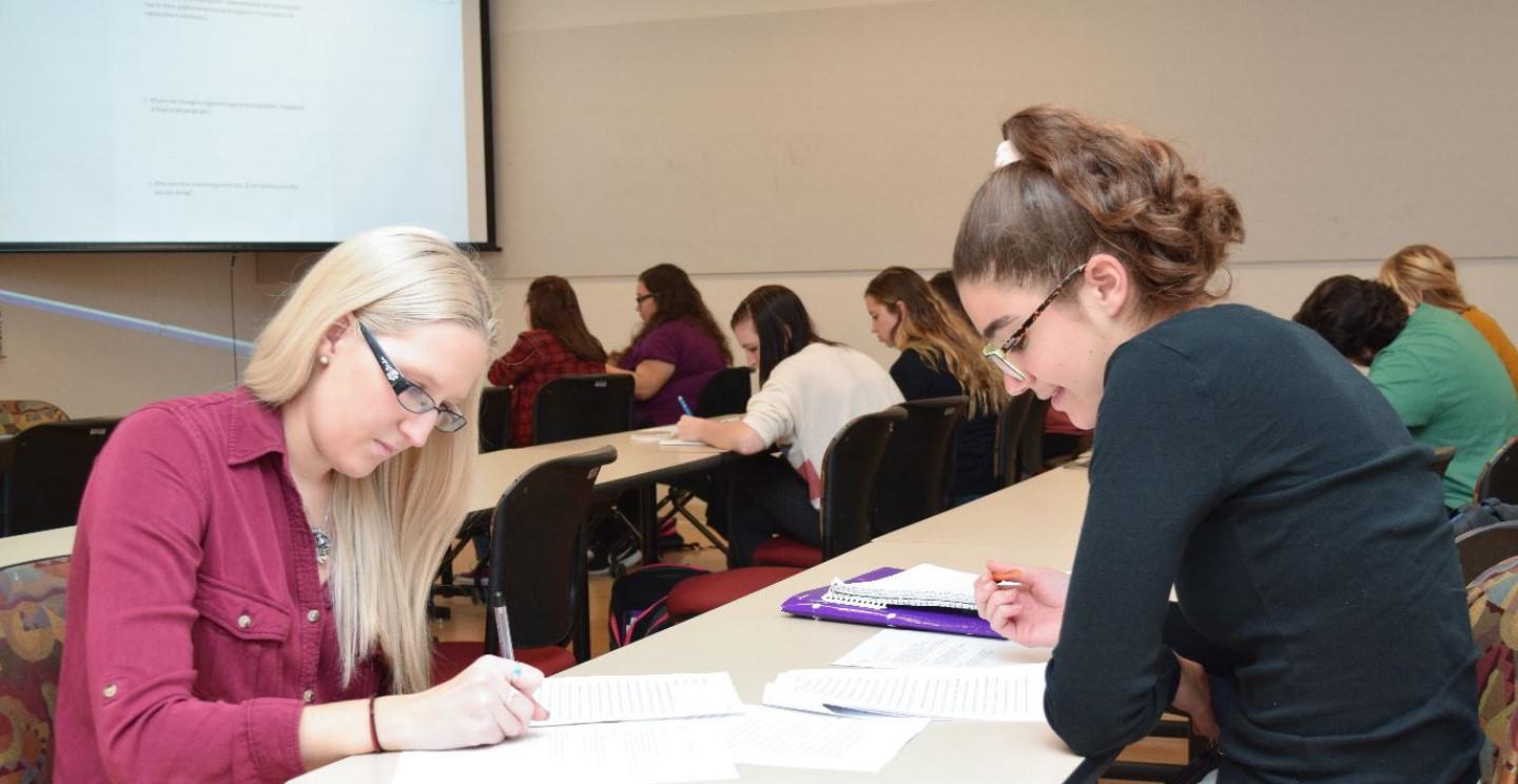 two students working in classroom