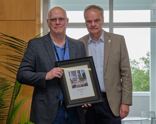Dr. Kevin Birch accepting an award