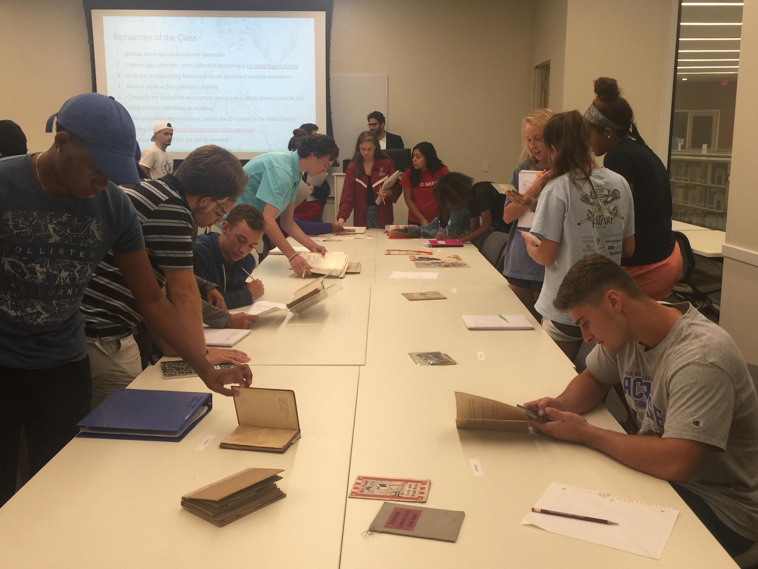 Large table of students and faculty 