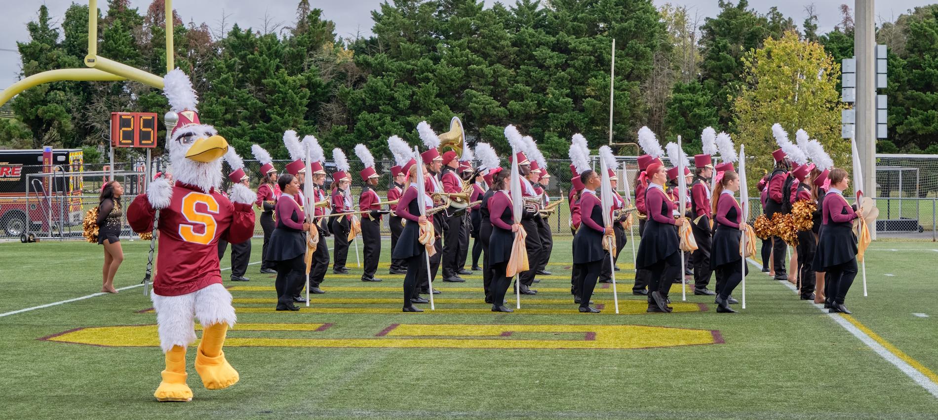 SU's marching band preforming at Sea Gull Stadium during homecoming