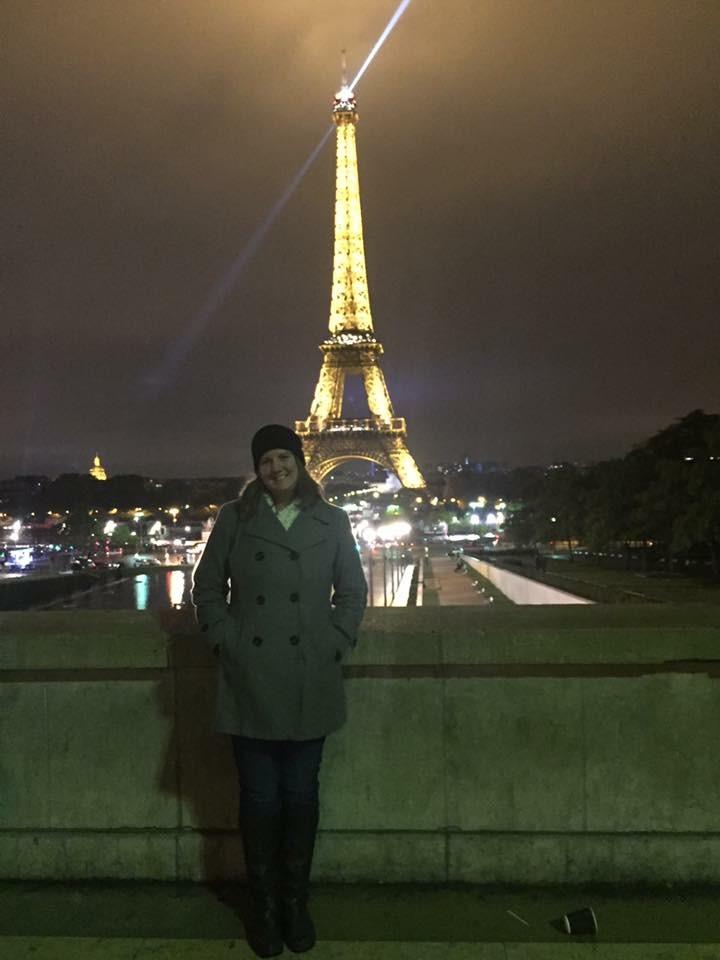 Caitlin Cleveland in front of the Eiffel Tower