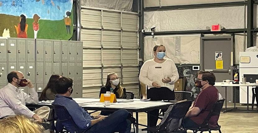 Students converse at a table during a transportation talk