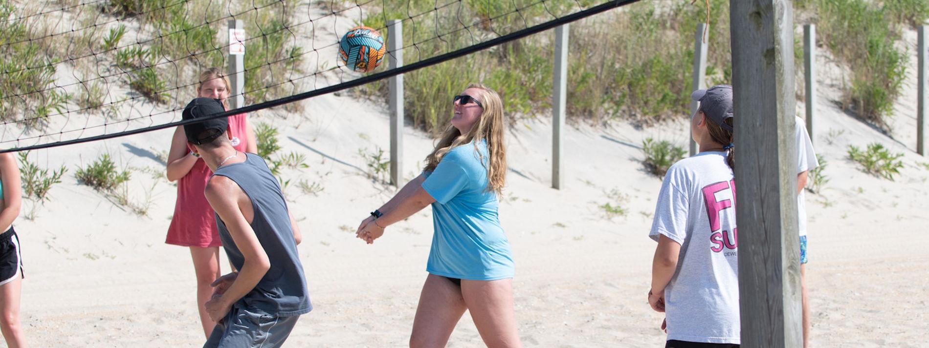 students playing volleyball