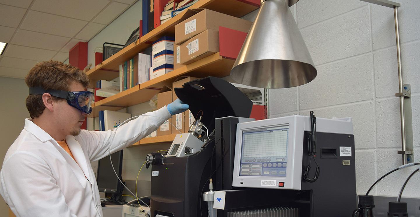 student working with equipment in lab