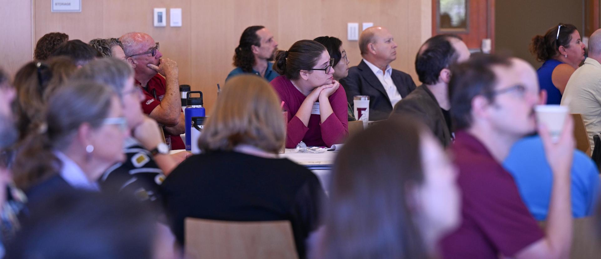 Faculty talk and converse at a meet up event