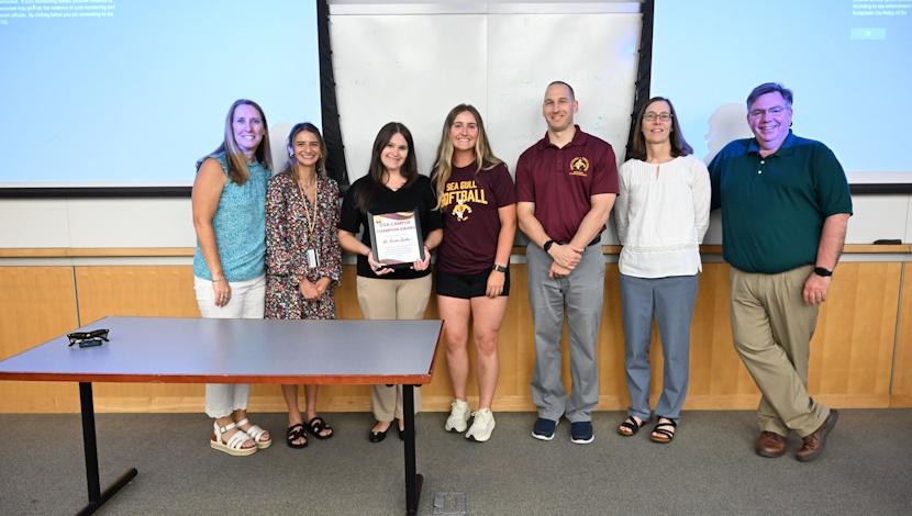 Campus Champion Dr. Kirsten Guckes receiving the award