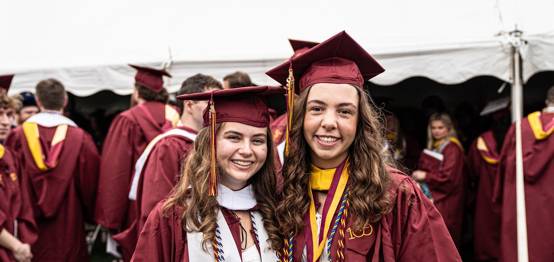 Students smiling at graduation