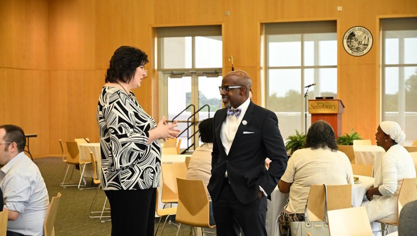 Provost talks to faculty member
