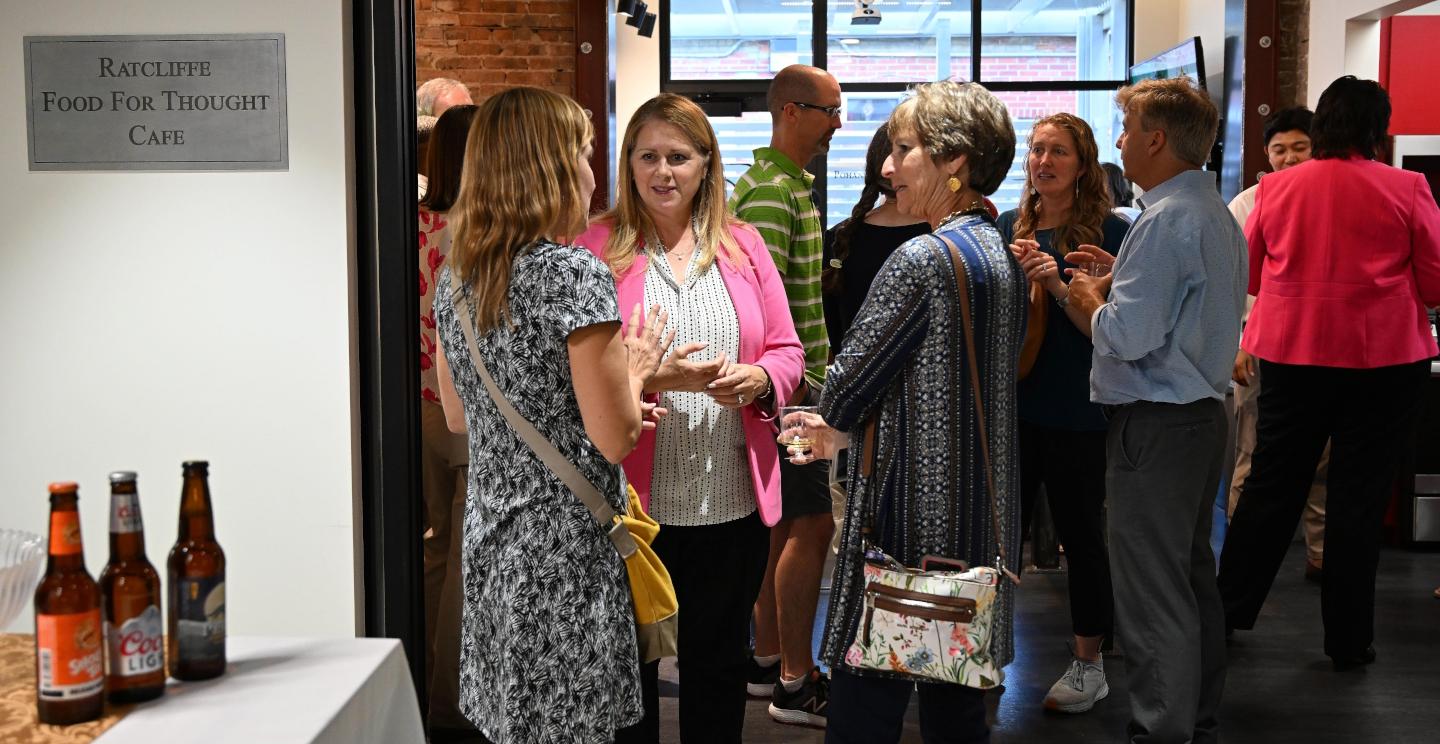 President Lepre talks with faculty members