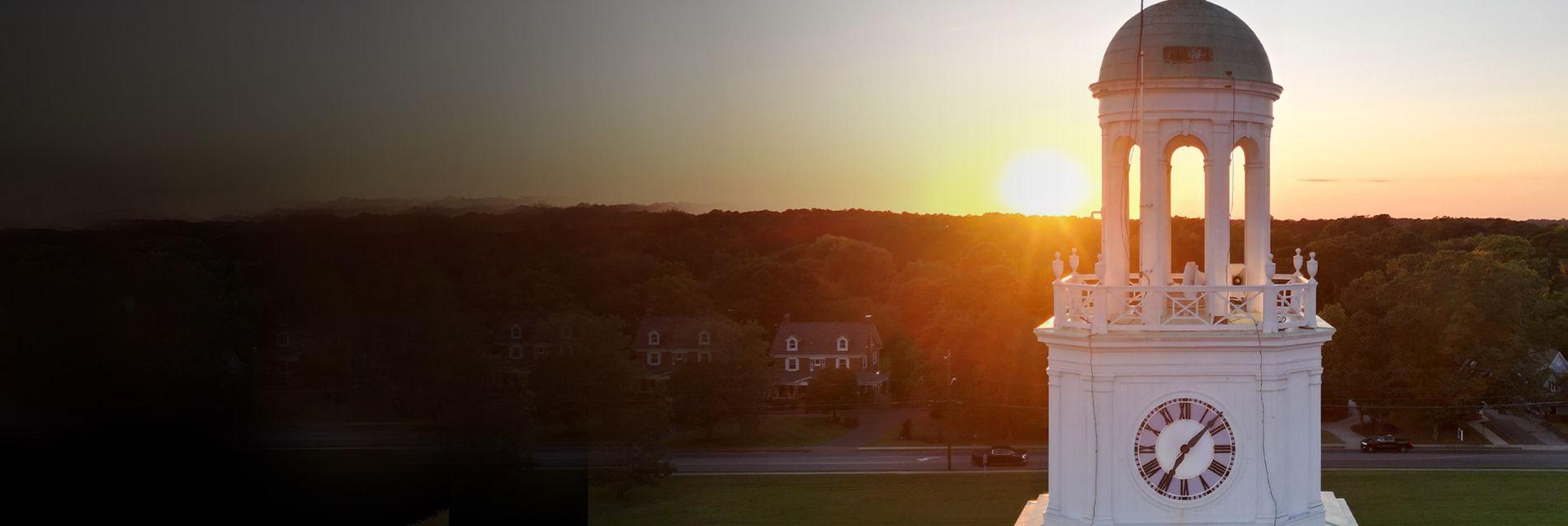 Holloway Hall bell tower sunrise in background