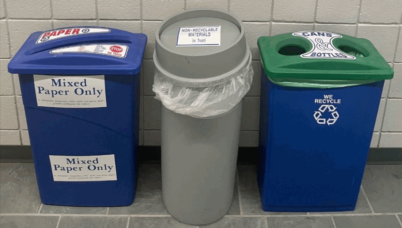 Recycling bins in a hallway on campus