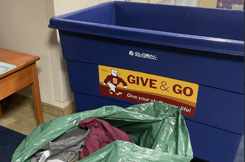 Donated items shown next to Give-&Go Bin