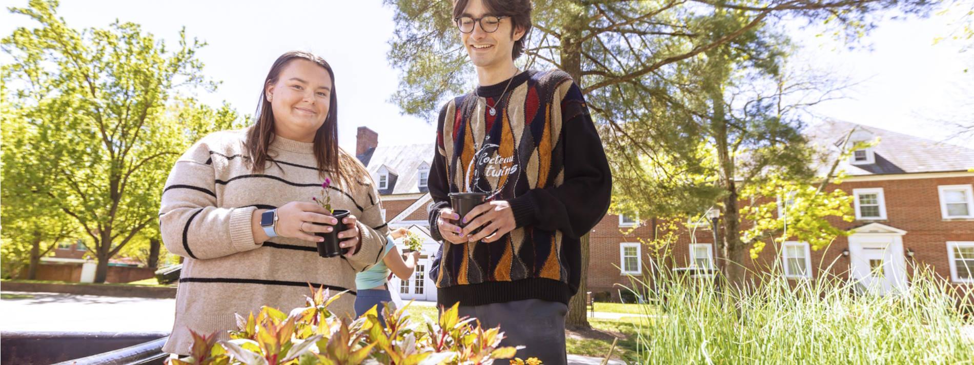 Students outdoors with plants