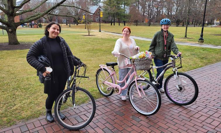 Students on campus with bikes