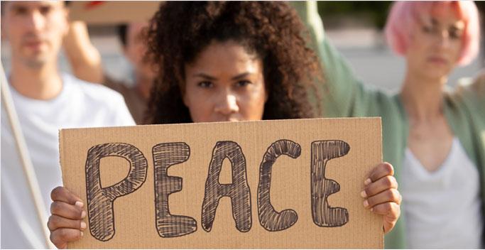 girl holding peace sign