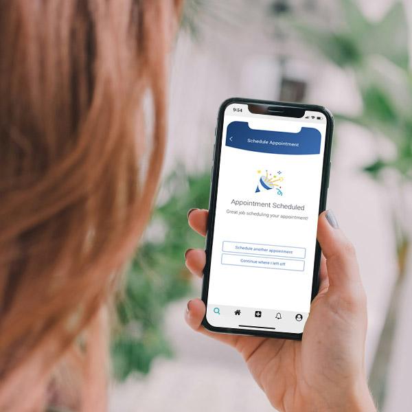 student holding phone with navigate app- Photo by abillion on Unsplash