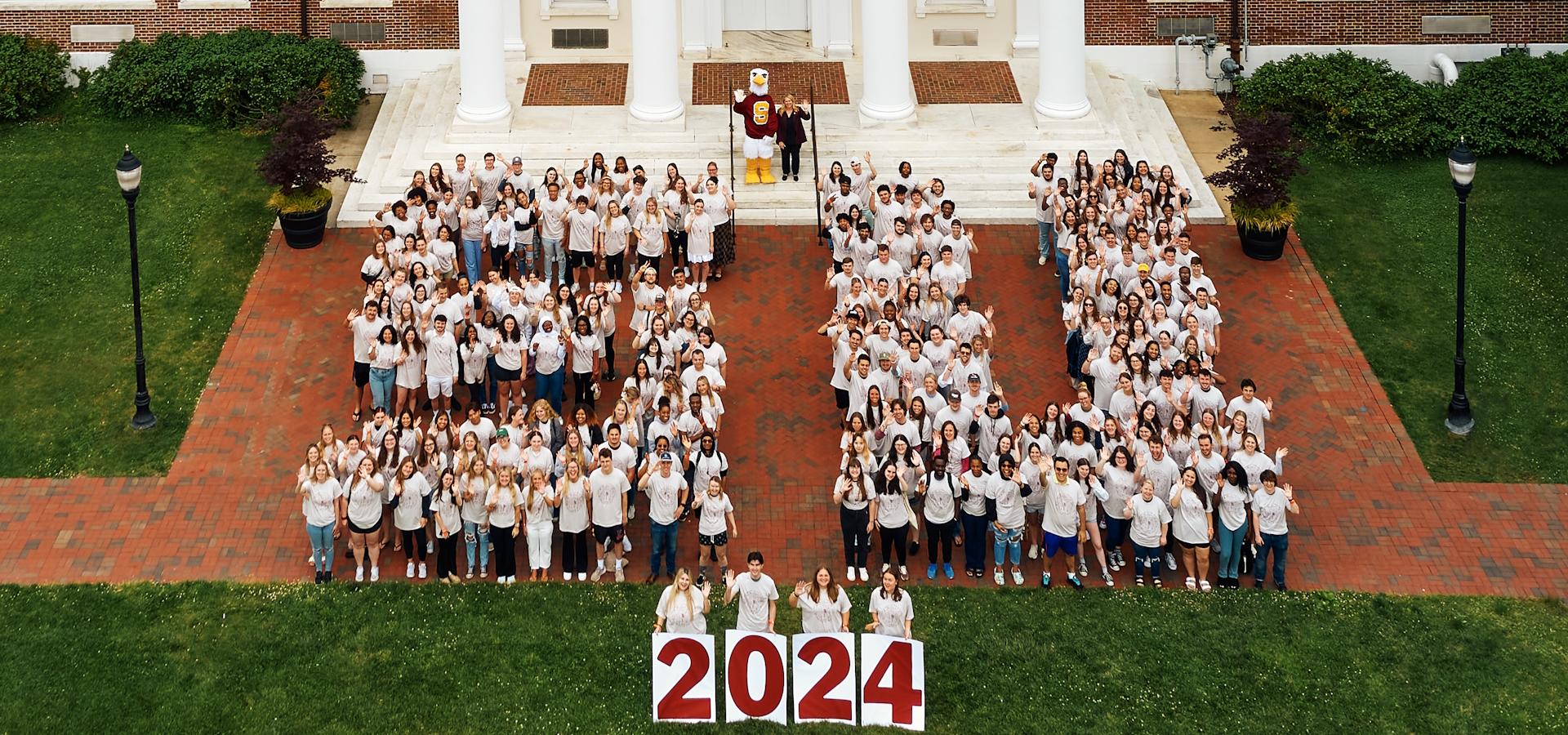 2024 Class areial photo showing students standing on the shape of "SU"