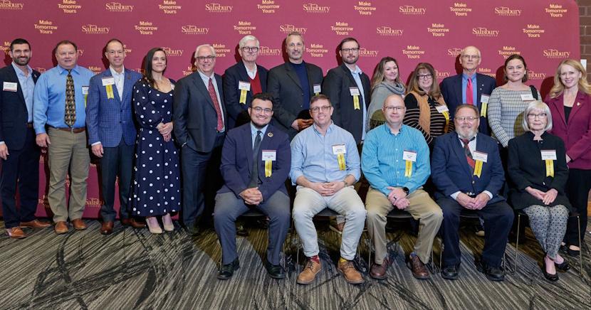 Top, from left: SU Alumni Association President Austin Whitehead, 2021 Faculty Appreciation Award recipient Brian Polkinghorn, Honorary Alumni Award recipient Brent Miller ’90, Service to Society Award recipient Danielle Thomas ’13, 2026 Faculty Appreciation Award recipient Lance Garmon, 2021 Faculty Appreciation Award recipient Stephen Adams, 2026 Faculty Appreciation Award recipients Herman Manakyan and Stephen Habay, 2021 Faculty Appreciation Award recipient Brandye Nobiling, 2026 Faculty Appreciation Award recipient Lisa Joyner, Excellence in Teaching Award recipient Jon Andes, SU Interim Provost and Vice President of Academic Affairs Jessica Clark; and SU President Carolyn Ringer Lepre. Front, from left: Gulls of the Last Decade (GOLD) Award recipient Juan Arango Millan ’20, 2026 Faculty Appreciation Award recipient Alexander Pope, Service to Society Award recipient Chris Truitt ’02, 2021 Faculty Appreciation Award recipient Eugene Williams, and Alumni Leadership Award recipient Glenda Chatham Clarke.