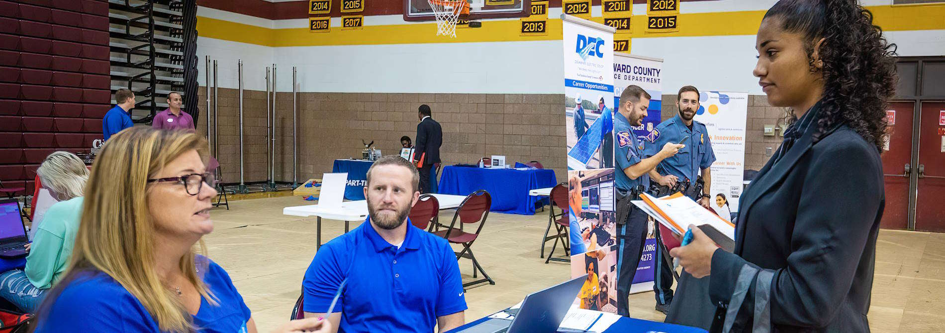 Student speaking with employer at Career fair