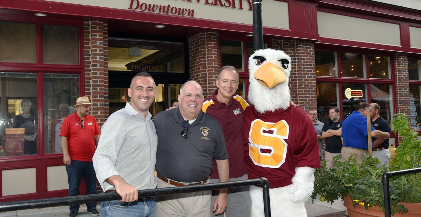 Salisbury Mayor Jake Day, Maryland Governor Larry Hogan, Salisbury University President Chuck Wight and Sammy Sea Gull in front of the Salisbury University Downtown Campus during the National Folk Festival in Salisbury, Maryland