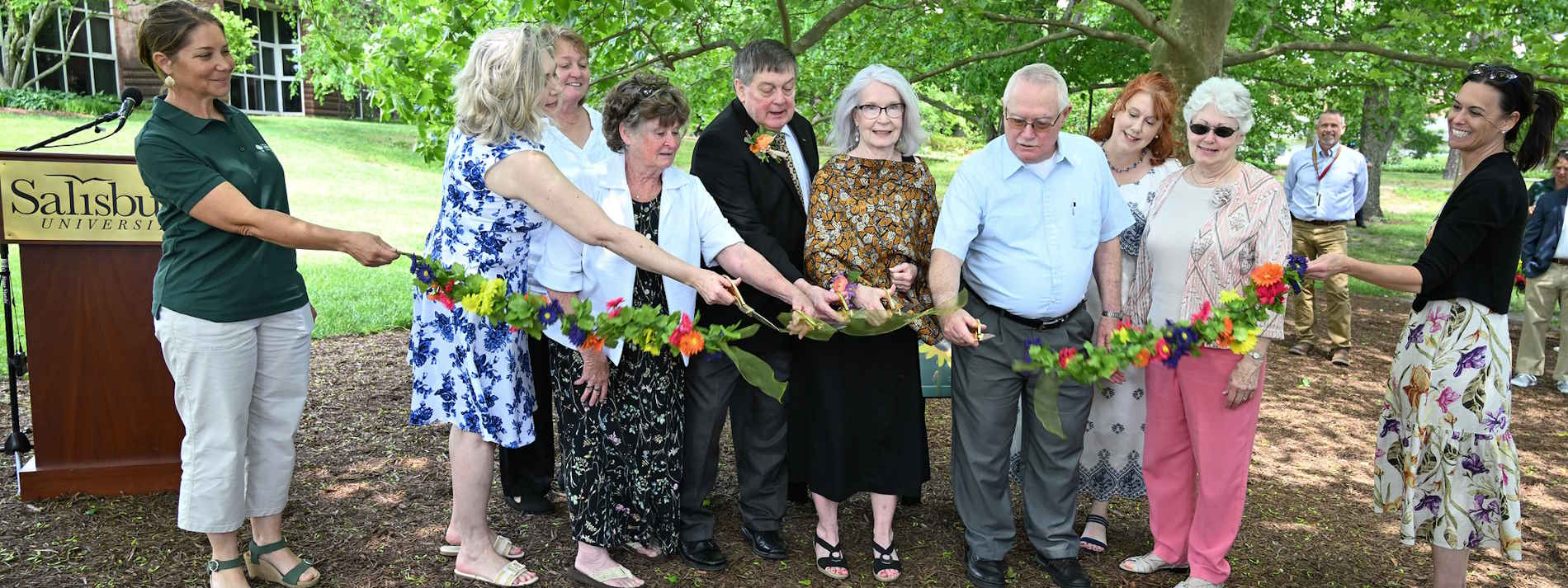 Attendess cutting the ribbon at the naming ceremony
