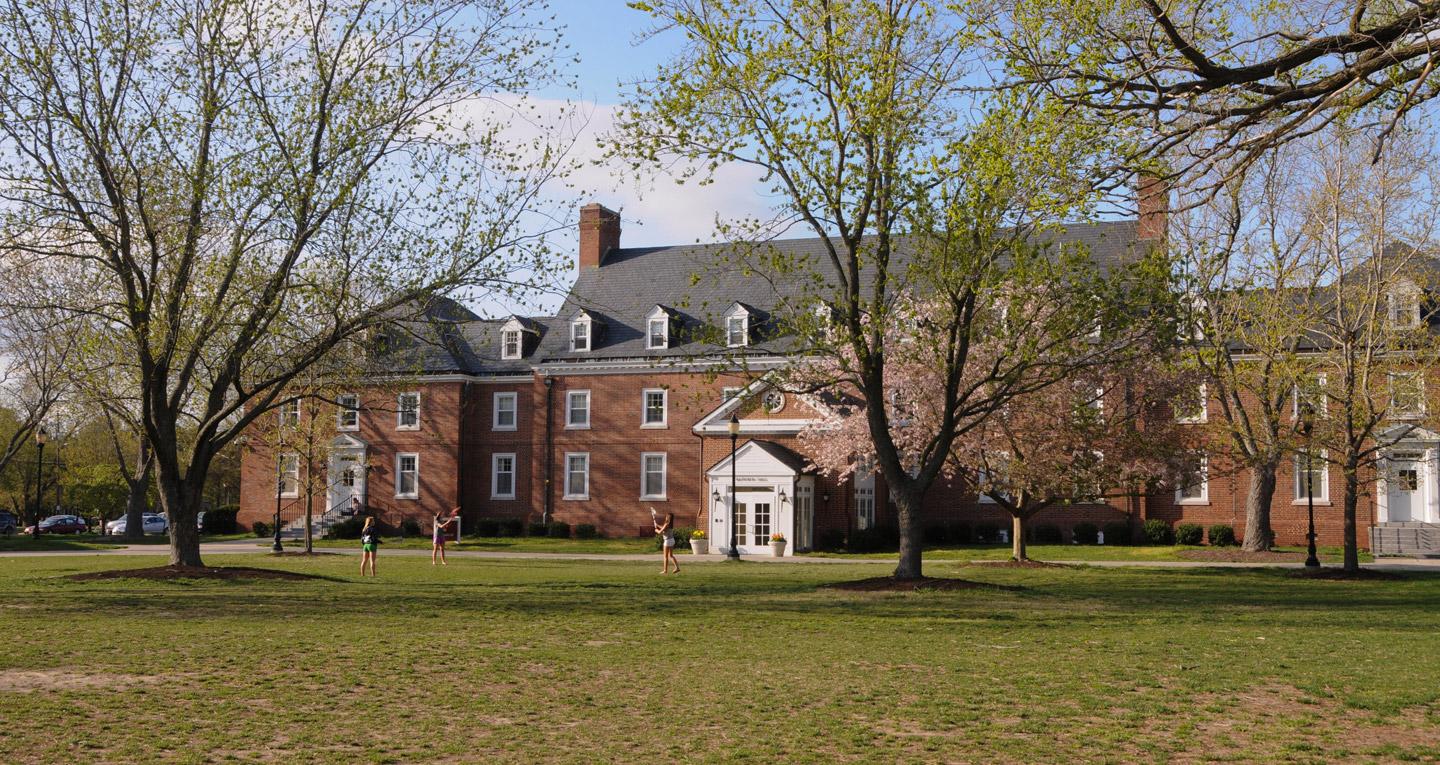 girls playing lacrosse in the quad