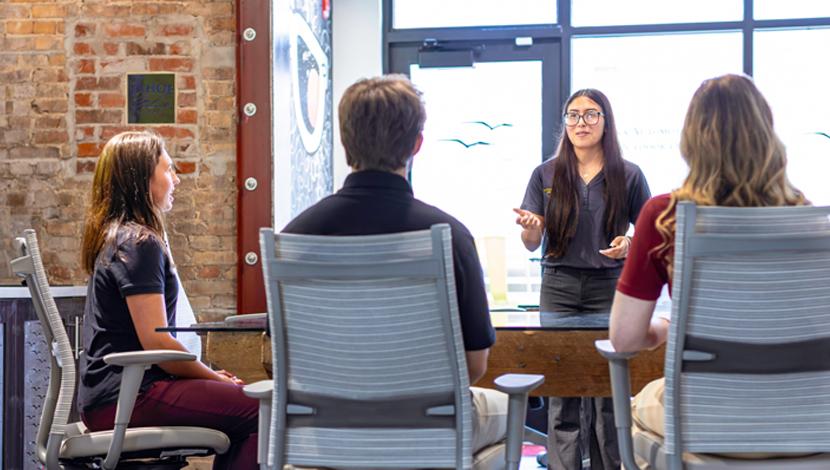 Perdue Faculty meet in a meeting room