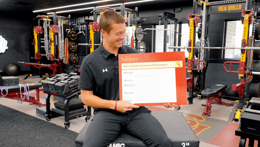 Matt Schuler sitting in a SU weight room