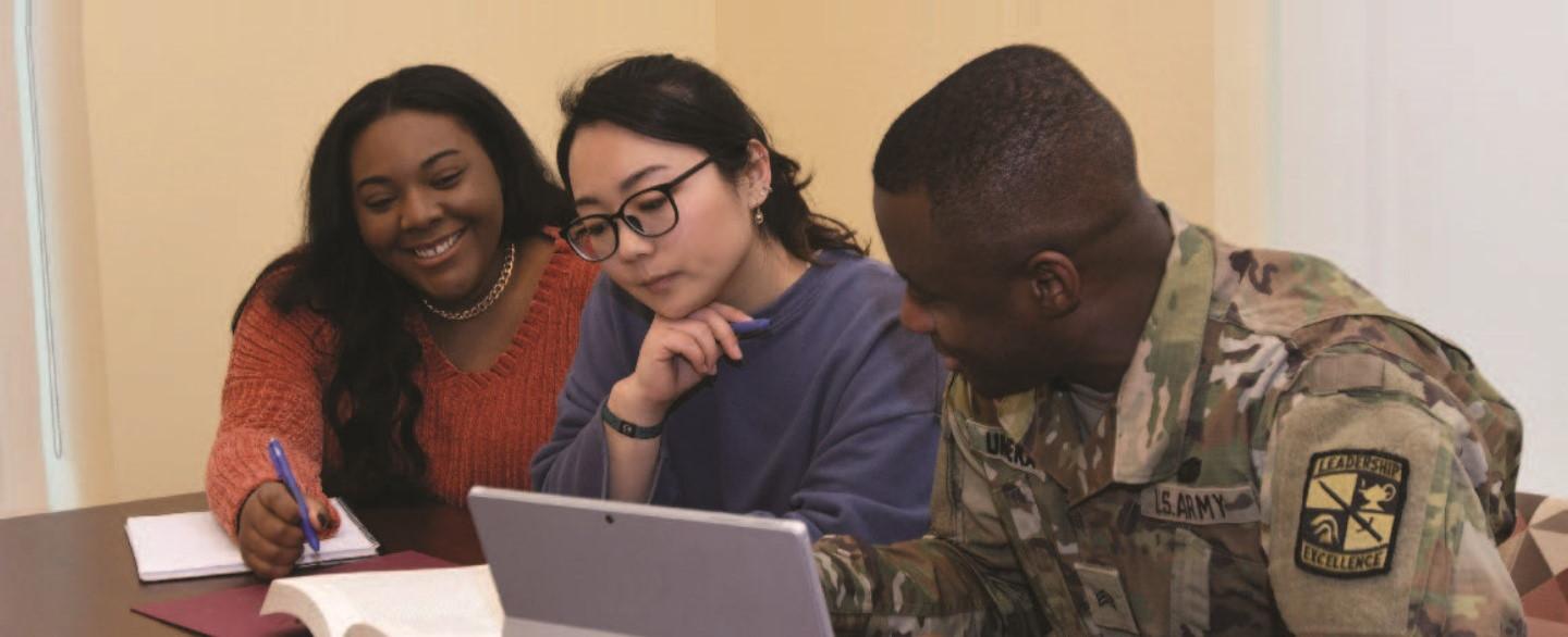 three students studying for a master in social work