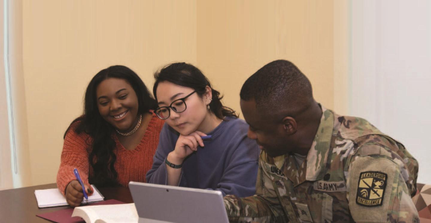 three students studying for a master in social work