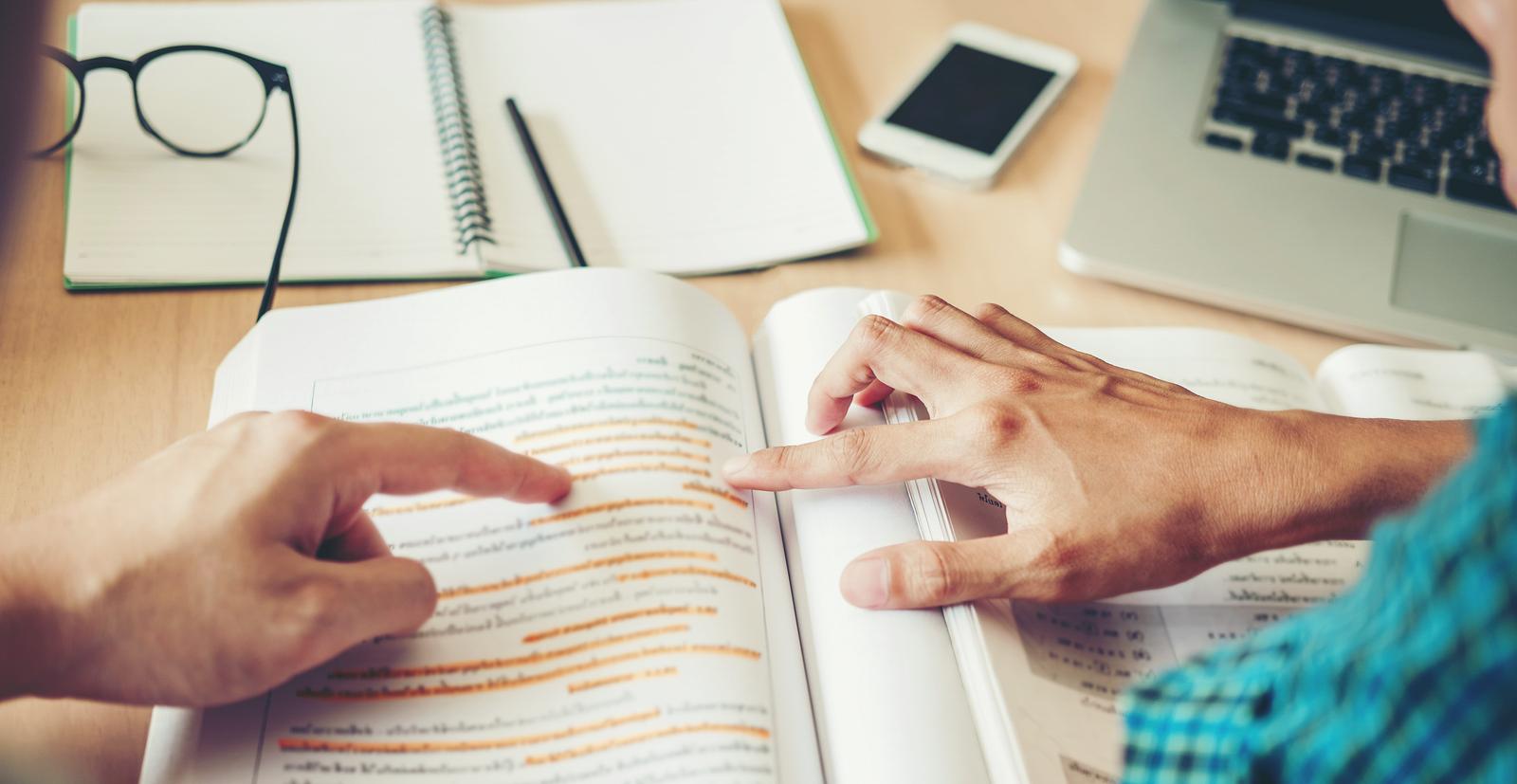 A graduate of Salisbury University's Master of Education Reading Specialist teaches a student to read.