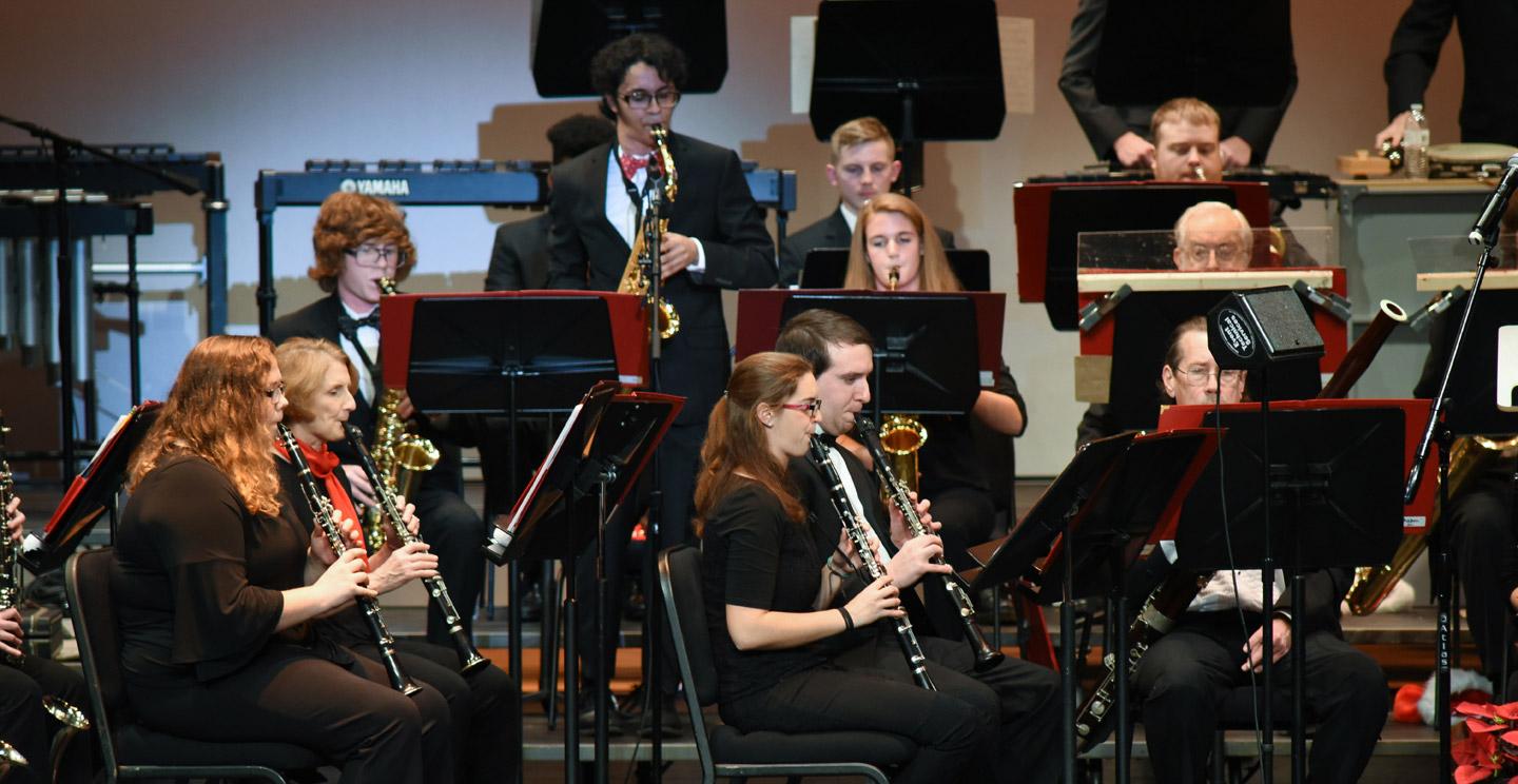 students playing instruments on stage