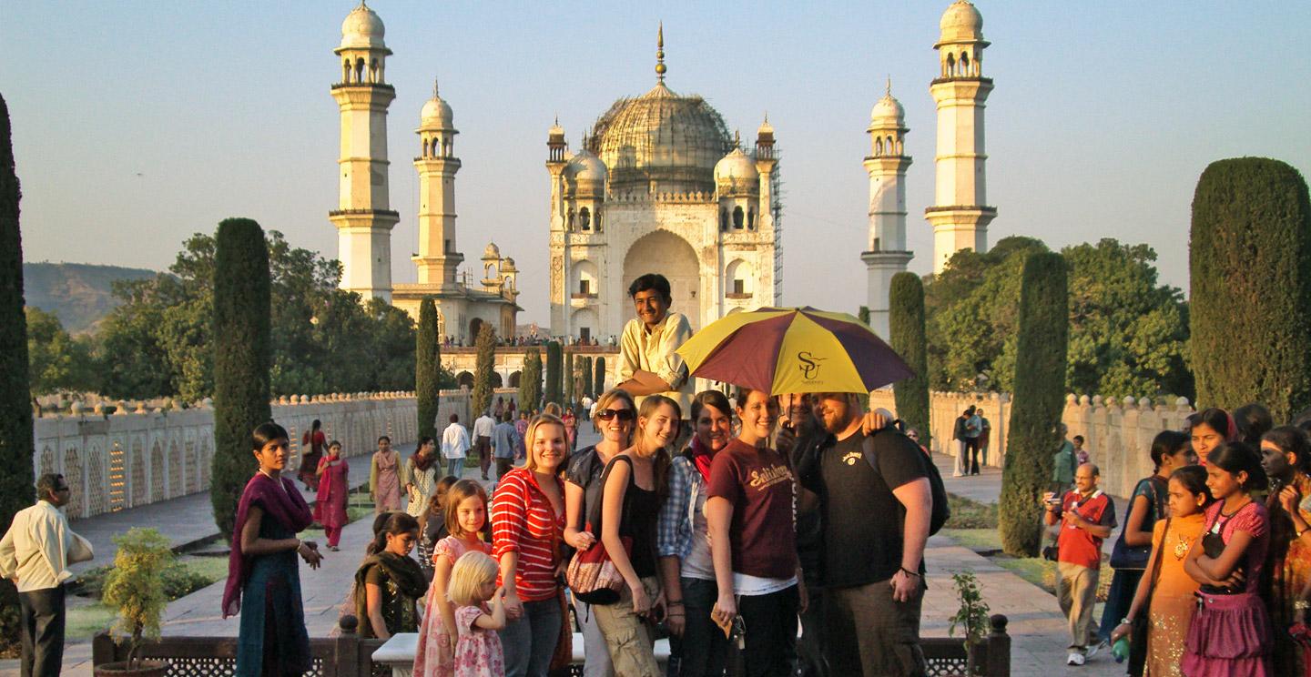 Students on a study abroad trip take a group photo