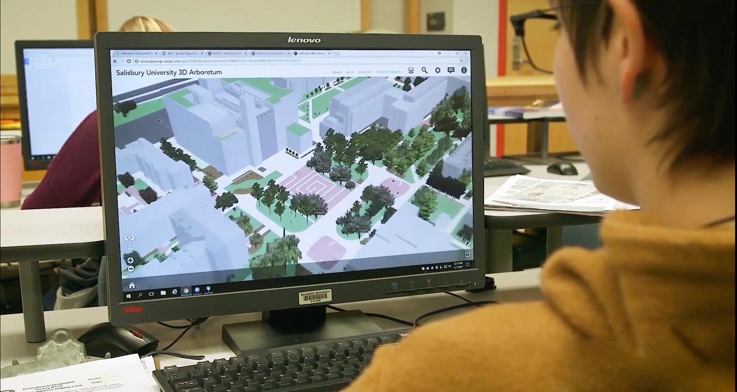 Urban planning student at computer looking at virtual map of Salisbury.