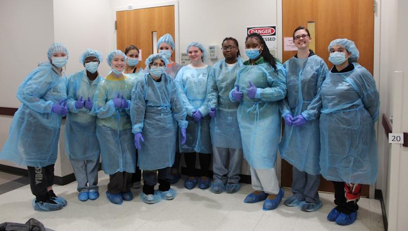 Forensic science students and forensic science club members don personal protective equipment (PPE) during a recent visit to the UMES cadaver lab