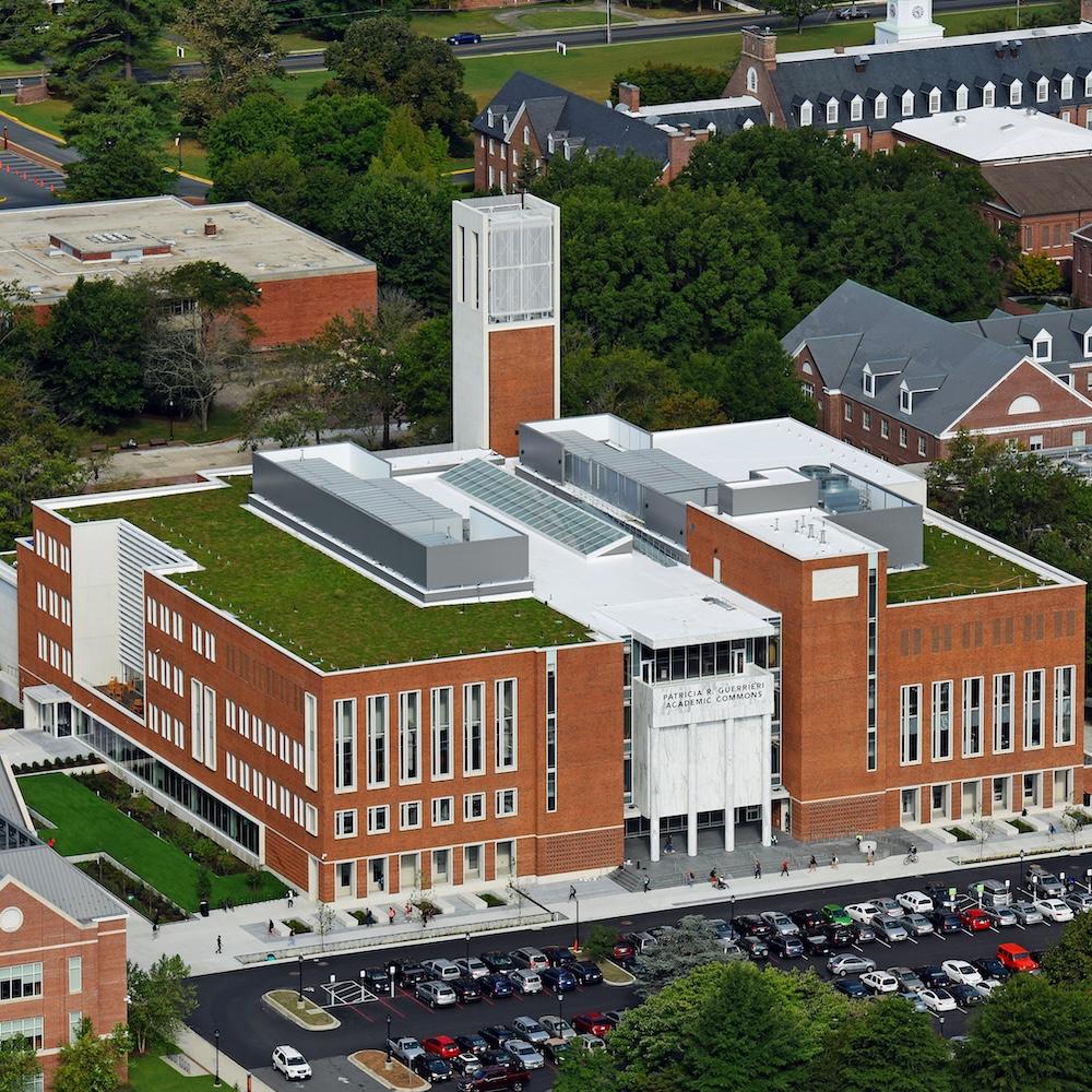 Aerial photo of the Guerrieri Academic Commons, showing a green roof, parking lot, and bell tower.
