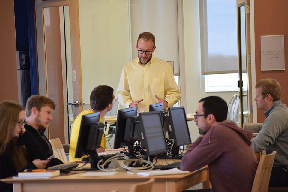 Dr. Creston Long instructing students in the Nabb Center