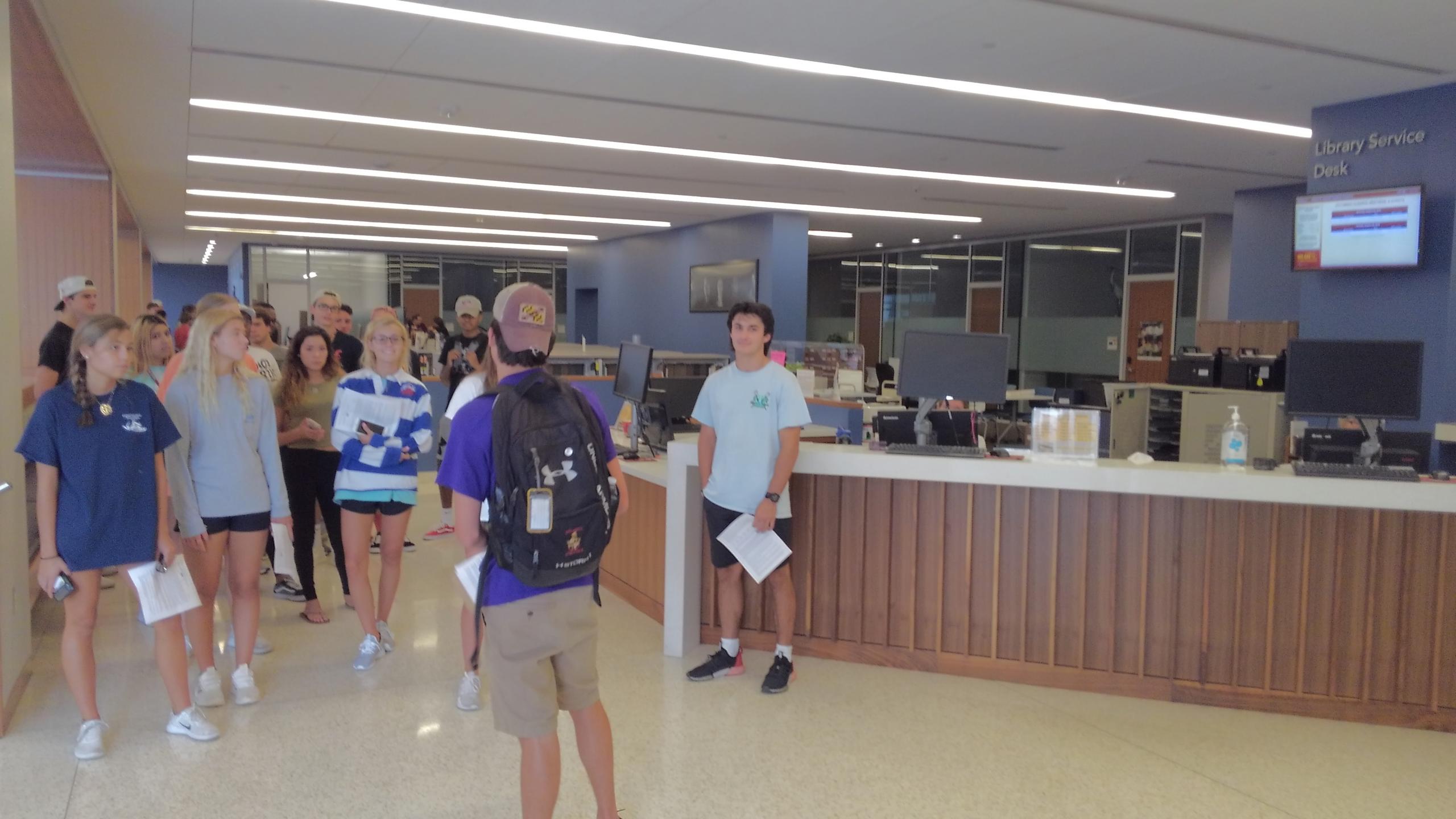 Students touring the Library Service Desk in the GAC