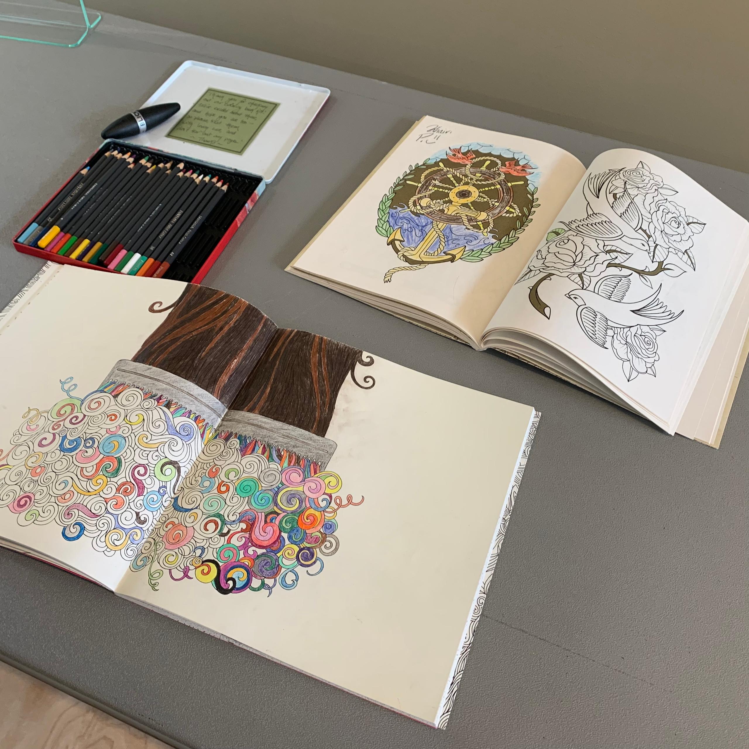 Coloring books on a table.