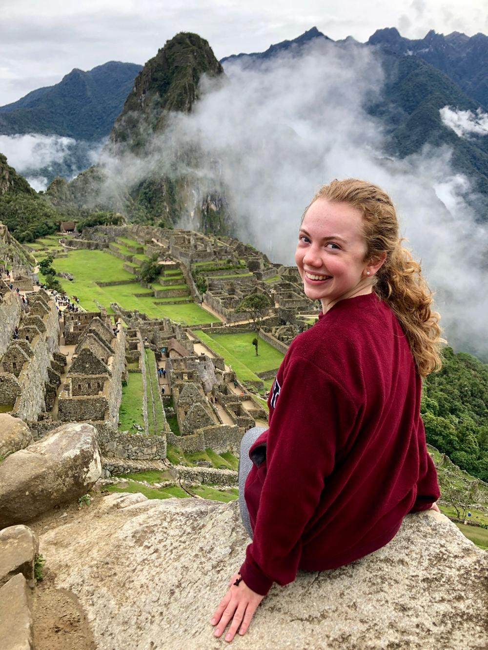 Student overlooking ancient ruins