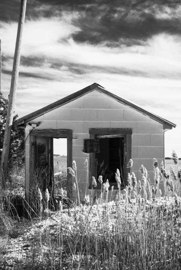 Award winning image from Salisbury Student. Shows a boat house on a beach