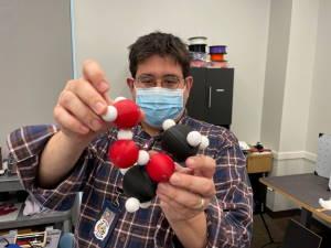 Dr. Josh Sokoloski with 3d molecules model